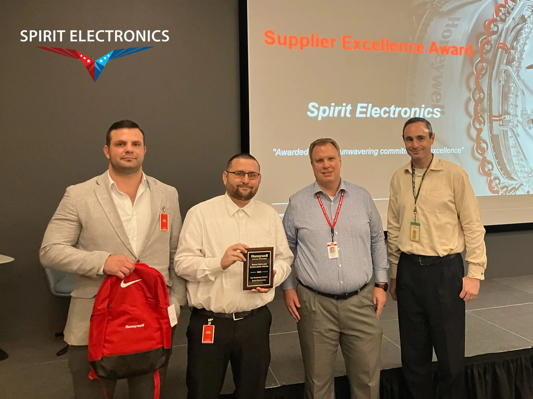 Daniel Rowan and Travis Ireland accept the Supplier Excellence Award at the Honeywell Space Supplier Summit 2024